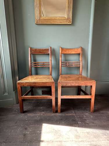 A pair of Early 19th Century Suffolk ball back vernacular side chairs