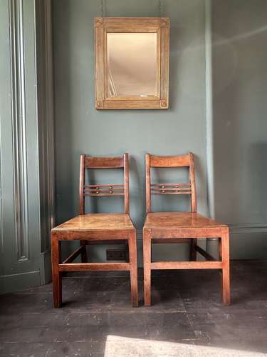 A pair of Early 19th Century Suffolk ball back vernacular side chairs
