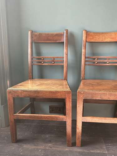 A pair of Early 19th Century Suffolk ball back vernacular side chairs