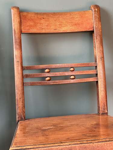 A pair of Early 19th Century Suffolk ball back vernacular side chairs
